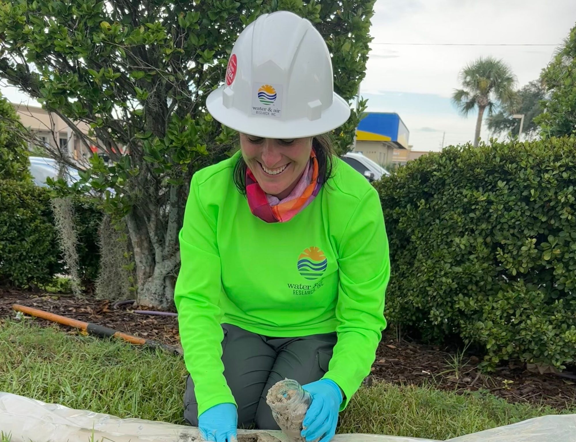 Photo of a scientist collecting a sample from a sediment core.